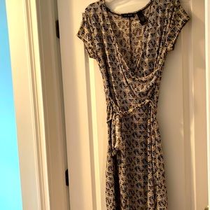Brown print faux wrap dress with tie.